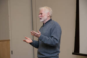 Photograph  12 of Bill Voxman's Colloquium Talk and Gallery Exhibition 'Communicating Communication through Black and White Photography: Connecting the Diverse with the Shared in Common.' Bill Voxman is Photographer and Professor Emeritus of Mathematics. Voxman's photographs were displayed in the UI Commons Reflections Gallery from January 9 to 27, 2012. Pictured: Bill Voxman.