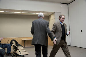 Photograph  2 of David Adler's Colloquium Talk 'Governing in an Era of Crisis: The Rule of Law and Emergency Powers.' David Adler is James A. McClure Professor and Director, McClure Center for Public Policy Research. Pictured L to R: Rodney Frey shakes hands with David Adler after introducing Adler's talk.