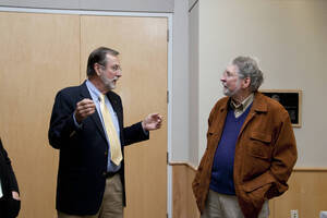 Photograph  2 of Marty Peterson's Colloquium Talk 'Reflections on Serving under Seven University of Idaho Presidents - Representing the University in all its Diversity and Universality.' Marty Peterson is Special Assistant to the President, Governmental Relations. Pictured: Marty Peterson talks to audience member before his colloquium talk.