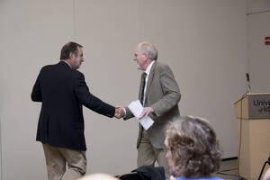 Photograph  4 of Marty Peterson's Colloquium Talk 'Reflections on Serving under Seven University of Idaho Presidents - Representing the University in all its Diversity and Universality.' Marty Peterson is Special Assistant to the President, Governmental Relations. Pictured L to R: Marty Peterson and Rodney Frey.
