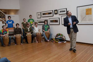 Photograph  1 of Barry Bilderback's Workshop and Performance 'Akwaaba and the Organization of Traditional Music and Dance in Ghanaian Culture.' Barry Bilderback is Assistant Professor of Music. Navin Chettri and World Beat were partners for the performance. Pictured: Barry Bilderback (far right), Navin Chettri (wearing hat), and performers at UI Prichard Gallery.