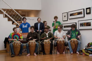 Photograph  2 of Barry Bilderback's Workshop and Performance 'Akwaaba and the Organization of Traditional Music and Dance in Ghanaian Culture.' Barry Bilderback is Assistant Professor of Music. Navin Chettri and World Beat were partners for the performance. Pictured:  Barry Bilderback, Navin Chettri, and performers at UI Prichard Gallery.