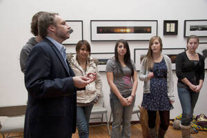 Photograph  27 of Barry Bilderback's Workshop and Performance 'Akwaaba and the Organization of Traditional Music and Dance in Ghanaian Culture.' Barry Bilderback is Assistant Professor of Music. Navin Chettri and World Beat were partners for the performance. Pictured: Barry Bilderback and audience participants at UI Prichard Gallery.