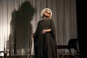 Photograph  4 of Robert Caisley and Lauren 'Lojo' Simon's Performance 'Adoration of Dora: a Play with Text and Images.' Robert Caisley, Associate Professor of Theatre Arts and Head of Dramatic Writing, directed the play. Lauren 'Lojo' Simon, MFA graduate student, wrote the play. Pictured: Cast members perform at dress rehearsal, University of Idaho Hartung Theater.