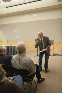 Photograph  1 of Dan Edwards's Colloquium Talk 'The Unique vs. The Universal: the Final Round.' Dan Edwards is Associate Professor of Physical Chemistry. Pictured: Rodney Frey introduces Dan Edwards, who is seated in the front row.