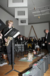 Photograph  6 of Dan Bukvich with Navin Chettri and the Jazz Choir I's Musical Performance 'The Village Sings and Drums and Dances, an evening of engaged voices and rhythms.' Dan Bukvich is Professor of Music. Navin Chettri is Bukvich's student. Pictured: Dan Bukvich and Jazz Choir I, University of Idaho Prichard Gallery.