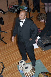 Photograph  9 of Dan Bukvich with Navin Chettri and the Jazz Choir I's Musical Performance 'The Village Sings and Drums and Dances, an evening of engaged voices and rhythms.' Dan Bukvich is Professor of Music. Navin Chettri is Bukvich's student. Pictured: Navin Chettri, University of Idaho Prichard Gallery.