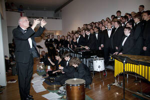 Photograph  14 of Dan Bukvich with Navin Chettri and the Jazz Choir I's Musical Performance 'The Village Sings and Drums and Dances, an evening of engaged voices and rhythms.' Dan Bukvich is Professor of Music. Navin Chettri is Bukvich's student. Pictured: Dan Bukvich and Jazz Choir I, University of Idaho Prichard Gallery.