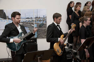 Photograph  15 of Dan Bukvich with Navin Chettri and the Jazz Choir I's Musical Performance 'The Village Sings and Drums and Dances, an evening of engaged voices and rhythms.' Dan Bukvich is Professor of Music. Navin Chettri is Bukvich's student. Pictured: Performers from Jazz Choir I, University of Idaho Prichard Gallery.