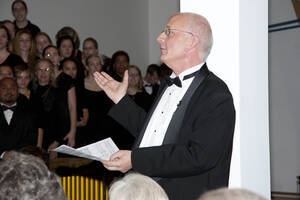 Photograph  17 of Dan Bukvich with Navin Chettri and the Jazz Choir I's Musical Performance 'The Village Sings and Drums and Dances, an evening of engaged voices and rhythms.' Dan Bukvich is Professor of Music. Navin Chettri is Bukvich's student. Pictured: Dan Bukvich, University of Idaho Prichard Gallery.