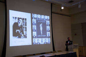 Photograph  5 of Robert Caisley, Marco Deyasi, and Lauren 'Lojo' Simon's Colloquium Panel Discussion 'Art about Art: Collaboration and Expression of Self and Other in Creating New Work for Theatre (on the play "Adoration of Dora").' Robert Caisley is Associate Professor of Theatre Arts and Head of Dramatic Writing. Marco Deyasi is Assistant Professor of Art and Design. Lauren 'Lojo' Simon is a graduate student. Pictured: Marco Deyasi.