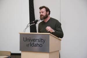 Photograph  8 of Robert Caisley, Marco Deyasi, and Lauren 'Lojo' Simon's Colloquium Panel Discussion 'Art about Art: Collaboration and Expression of Self and Other in Creating New Work for Theatre (on the play "Adoration of Dora").' Robert Caisley is Associate Professor of Theatre Arts and Head of Dramatic Writing. Marco Deyasi is Assistant Professor of Art and Design. Lauren 'Lojo' Simon is a graduate student. Pictured: Robert Caisley.