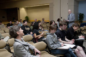 Photograph  2 of Nancy Chaney's Colloquium Talk 'Adventures of time and space travel aboard an amazing machine: The wheel as political metaphor..' Nancy Chaney is an alumnus of University of Idaho and Mayor of Moscow. Pictured: Rodney Frey introduces Nancy Chaney, who is seated lower left.