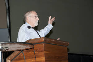 Photograph  6 of Rodney Frey's Keynote Address 'Turning of the Wheel: Meeting the Challenges and Charting - Creating the World with Spokes and a Hub.' Rodney Frey is Professor of Ethnography and Distinguished Humanities Professor. Pictured: Rodney Frey, Administration Auditorium, UI Moscow.