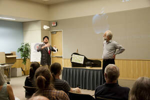 Photograph  3 of Dan Edwards's Colloquium Talk 'The Unique vs. The Universal: the Final Round.' Dan Edwards is Associate Professor of Physical Chemistry. Pictured: Dan Edwards and student assistant.