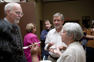 Photograph  16 of Rodney Frey's Keynote Address 'Turning of the Wheel: Meeting the Challenges and Charting - Creating the World with Spokes and a Hub.' Rodney Frey is Professor of Ethnography and Distinguished Humanities Professor. Pictured: Rodney Frey and audience members after his Keynote Address, Administration Auditorium, UI Moscow.