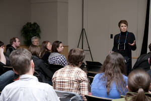 Photograph  10 of Janis Johnson's Colloquium Talk 'This Is the Sound of Survivance: Nez Perce Indians Playing Jazz.' Janis Johnson is Assistant Professor English. Pictured: Janis Johnson talks with audience.