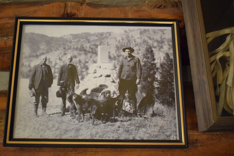 In this 1927 photograph, Governor Clarence Baldridge, Dave Lewis, and Regional Forester R.H. Rutledge stand from left to right by the monument for private Harry Eagan who was killed in August of 1879 during the Sheepeater War.