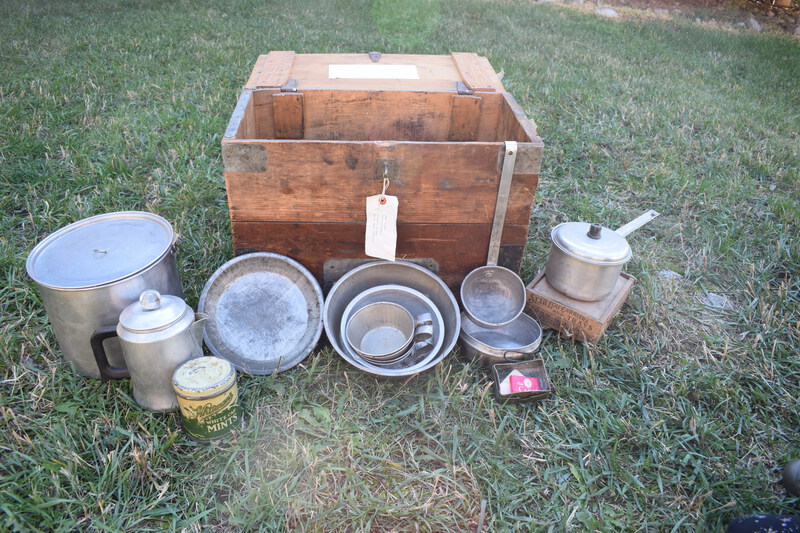 W.H. Bolles Cooking Trunk. In the days before gasoline drums, gasoline was sold in 5-gallon cans, two cans to a wooden box, for use in areas remote from service stations. These boxes were in common use among horse campers for carrying "the kitchen", as it was known. They fitted nicely into canvas pack saddle bags known as an alforjas (Spanish name) which were suspended from the pack saddle by leather loops. I reinforced them with metal strips, added covers and locks and used them when horse camping in Idaho, Wyoming, Washington, and Oregon. The nest of aluminum kettles, cast iron frying pan, break proof egg carton and other items were very useful to horse campers of that bygone era. These items are being sent to the Taylor Ranch for display among their archives.