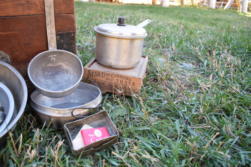 W.H. Bolles Cooking Trunk. In the days before gasoline drums, gasoline was sold in 5-gallon cans, two cans to a wooden box, for use in areas remote from service stations. These boxes were in common use among horse campers for carrying "the kitchen", as it was known. They fitted nicely into canvas pack saddle bags known as an alforjas (Spanish name) which were suspended from the pack saddle by leather loops. I reinforced them with metal strips, added covers and locks and used them when horse camping in Idaho, Wyoming, Washington, and Oregon. The nest of aluminum kettles, cast iron frying pan, break proof egg carton and other items were very useful to horse campers of that bygone era. These items are being sent to the Taylor Ranch for display among their archives.