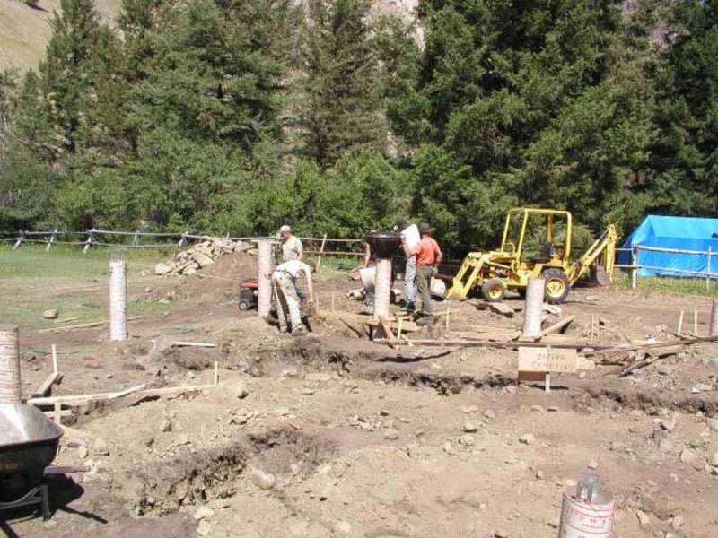 Starting to pour concrete in the foundation piers.