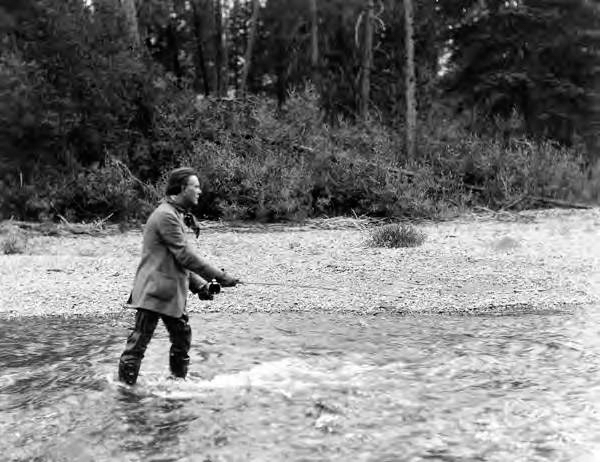 Senator William E. Borah fishing near Edwardsburg on Big Creek in primitive area.