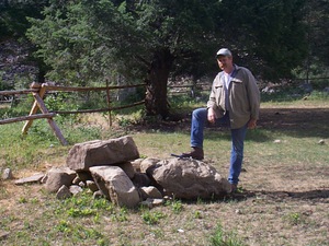 Jim Akenson shows why we need a backhoe.