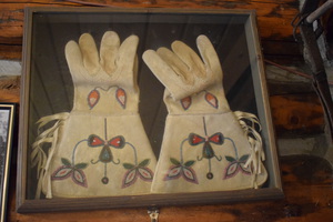 These "parade gloves" belonged to Dave Lewis. They were with his other treasured possessions in an old travel trunk that he left with Jess Taylor in 1936. Using the lining material pattern for dating these gloves were dated to 1880, the year after the Sheepeater Campaign was concluded where he served as a civilian ammunition packer. The bead pattern on these gloves is typical of bead-work done by Shoshone women of that time period. It is not known when Dave Lewis wore these gloves. One possibility was when the U.S. Army moved the small Sheepeater band from Fort Vancouver, Washington to Fort Hall, Idaho Territory in the spring of 1880. The close up images of the beadwork are from the Fort Hall Tribal Museum.