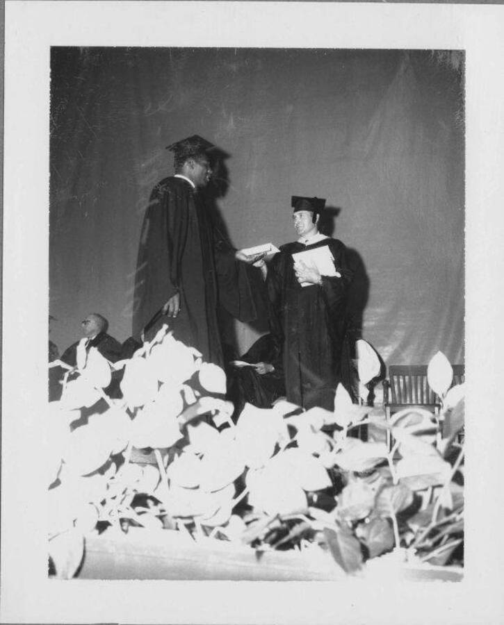 Ray McDonald receiving diploma.