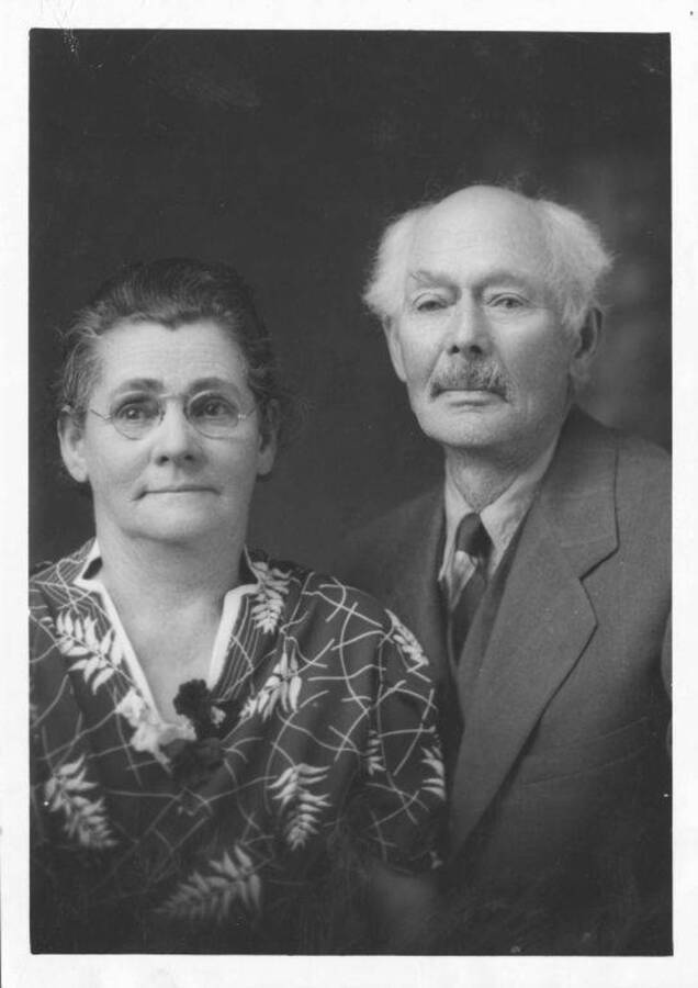 Caption reads: 'J. W. Brigham and wife. He is the only living founder of the University of Idaho. She was among the first students to enroll. 1939--now deceased--Mr. Brigham. Mr. and Mrs. J. W. Brigham, Genesee. Mr. Brigham introduced and pushed through to passage the bill creating the University in last territorial legislature in January, 1889. He then was youngest man in the 'council or senate' in the last territorial legislature, a kid of 32 years. Now 81, still active. He homesteaded the 320-acre farm on which he now lives in 1879. Then were only eight settlers living between Lewiston and Moscow. Has had five children attend university, youngest sophomore in engineering, now enrolled.' Portrait.
