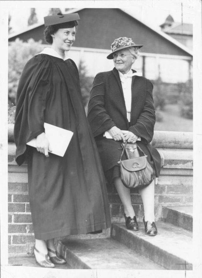 Caption reads: '1939 Julia Moore, left, wearing same gown her mother, Mrs. F. Cushing Moore, wore when she received degree in 1898. Mrs. Moore was Margaret McCallie.'