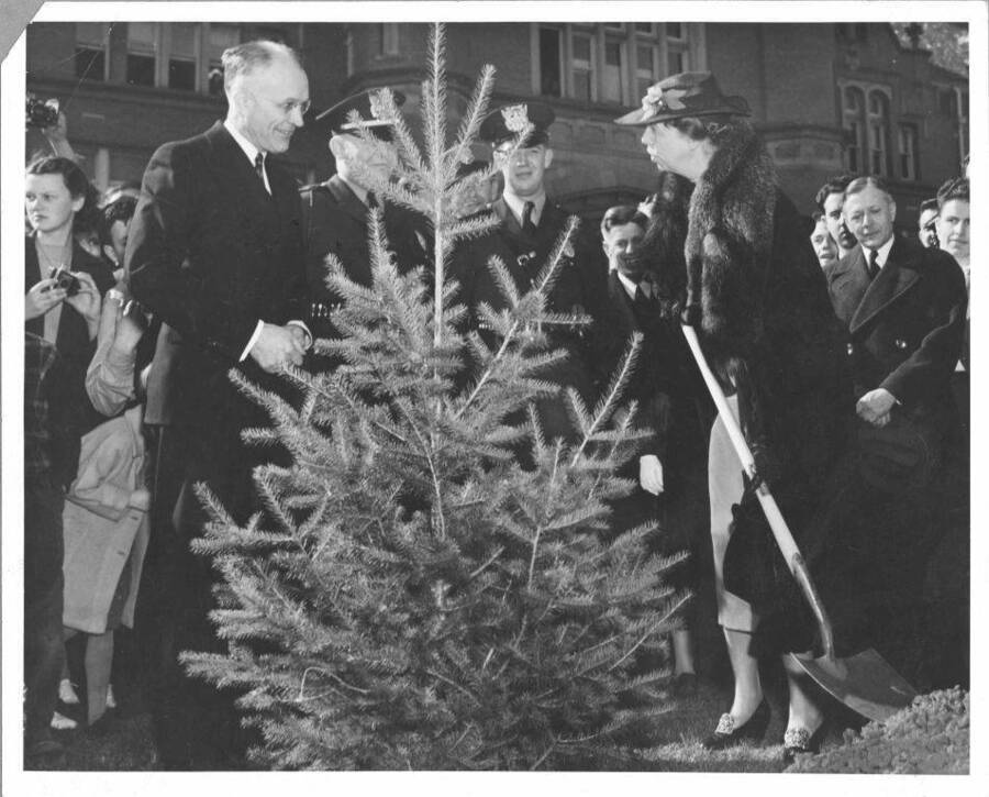 Eleanor Roosevelt (left) planting a tree during her visit in 1938.