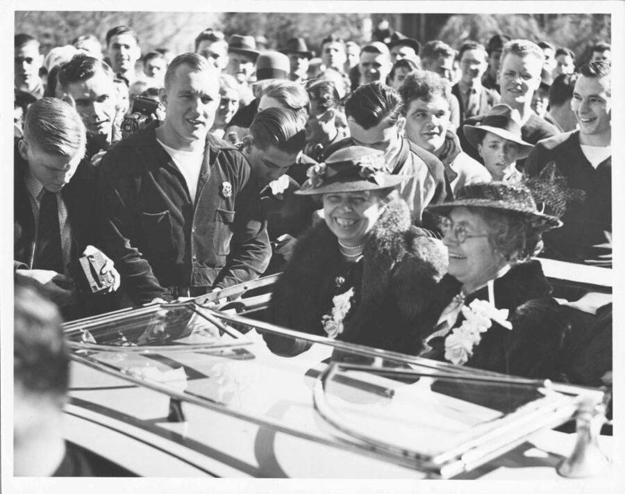 Eleanor Roosevelt and an unidentified woman ride in an automobile as they tour the University of Idaho Campus.