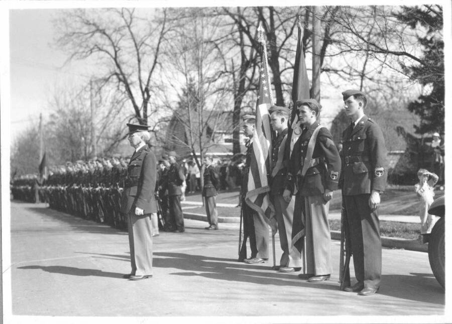 General Chrisman and honor guard with cadet battalion in background.