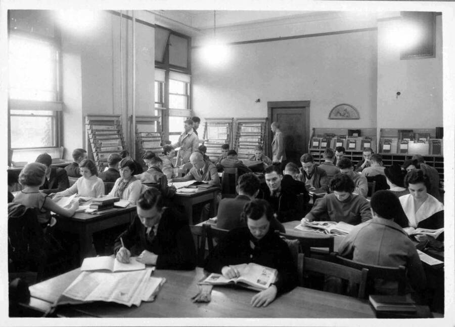 Students studying in the periodicals seciton of the library.