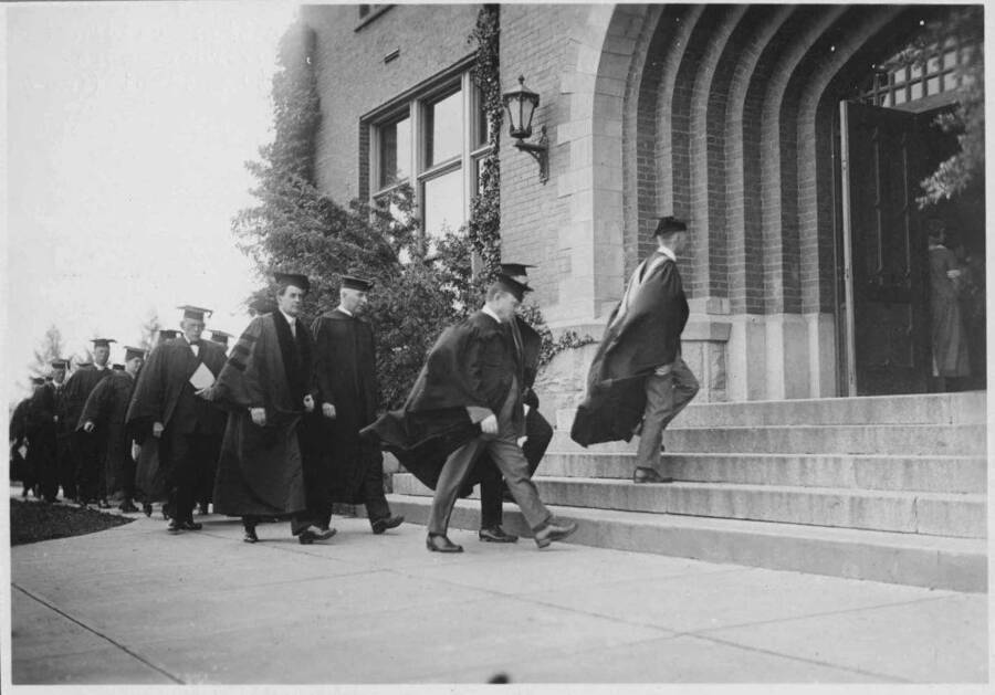 Commencement procession entering Administration Building June 1924. Professor Dale mounting the steps, Gov. Moore (foreground) and President Upham. Prince Gelasio Caetani (facing camera) and Stanly Easton.