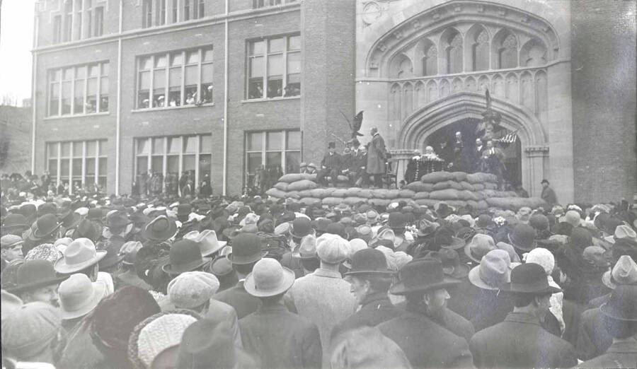 Theodore Roosevelt speaks from a platform in front of University of Idaho Administration Building.