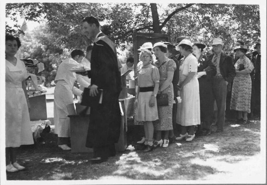 People waiting in line during the outdoor commencement luncheon.