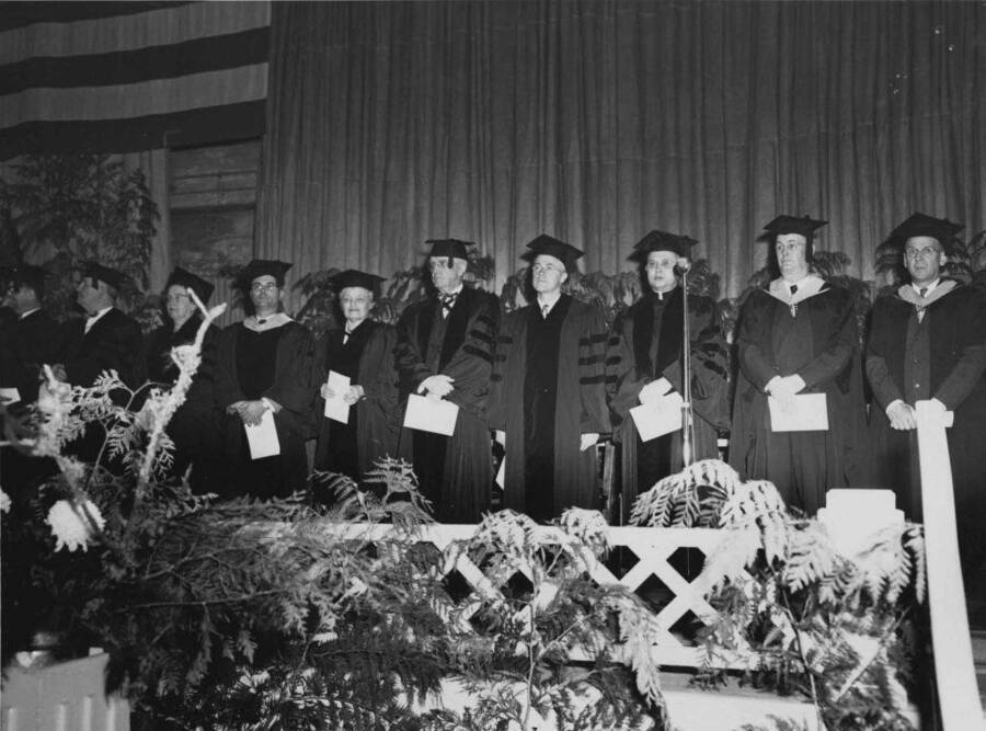 Right to left: D. D. DuSault, Registrar, Dean Lattig, Urban Schmitt, Titus G. LeClair, William E. Lee, Mrs. John E. Hayes.