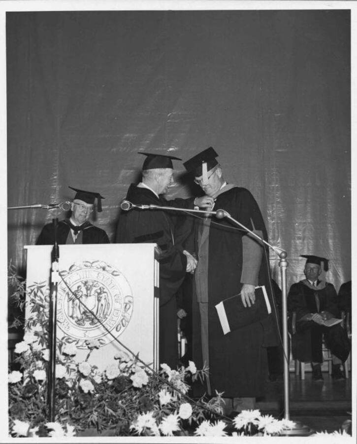 C.H. Foster and President Buchanan on commencement stage.