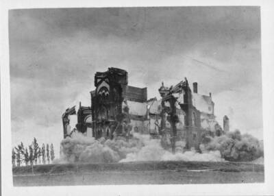 Dynamiting of walls of the Administration Building after fire.