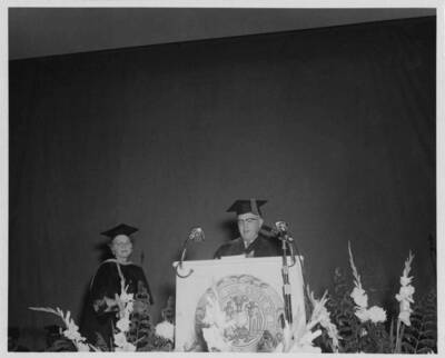 Louise Carter, Dean of Women retires. President D. R. Theophilus reads the citation of merit.