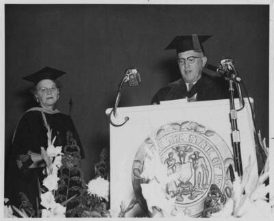 Louise Carter, Dean of Women retires. President D. R. Theophilus reads the citation of merit.
