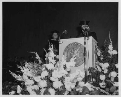 Louise Carter, Dean of Women retires. President D. R. Theophilus reads the citation of merit.