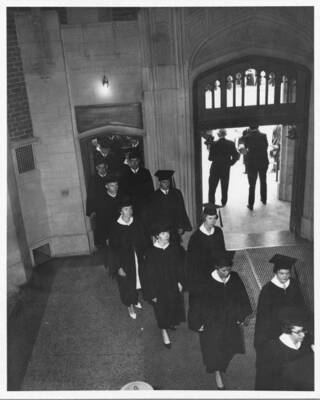 The procession files through the doors of the Memorial Gym.
