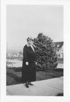 Permeal Jane French standing in walkway on campus.