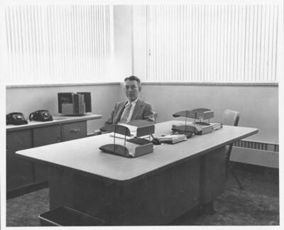 University of Idaho Librarian (1948 - 1967), in office of new library building (1958). Portrait.