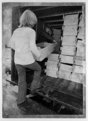 Books being loaded on truck for transporting to new building.