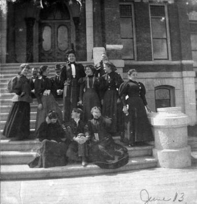 Home Economics students pose for a photo on steps.