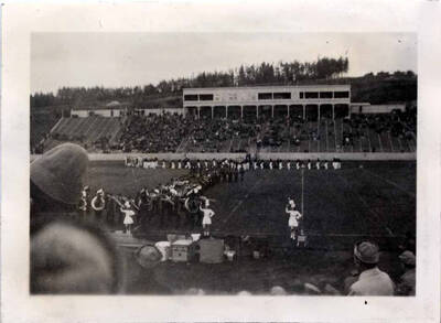 View of band marching from the stands at a football game.